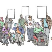 A group of people, including people using mobility devices, holding placards
