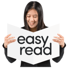 Disabled Asian woman looking at easy read information